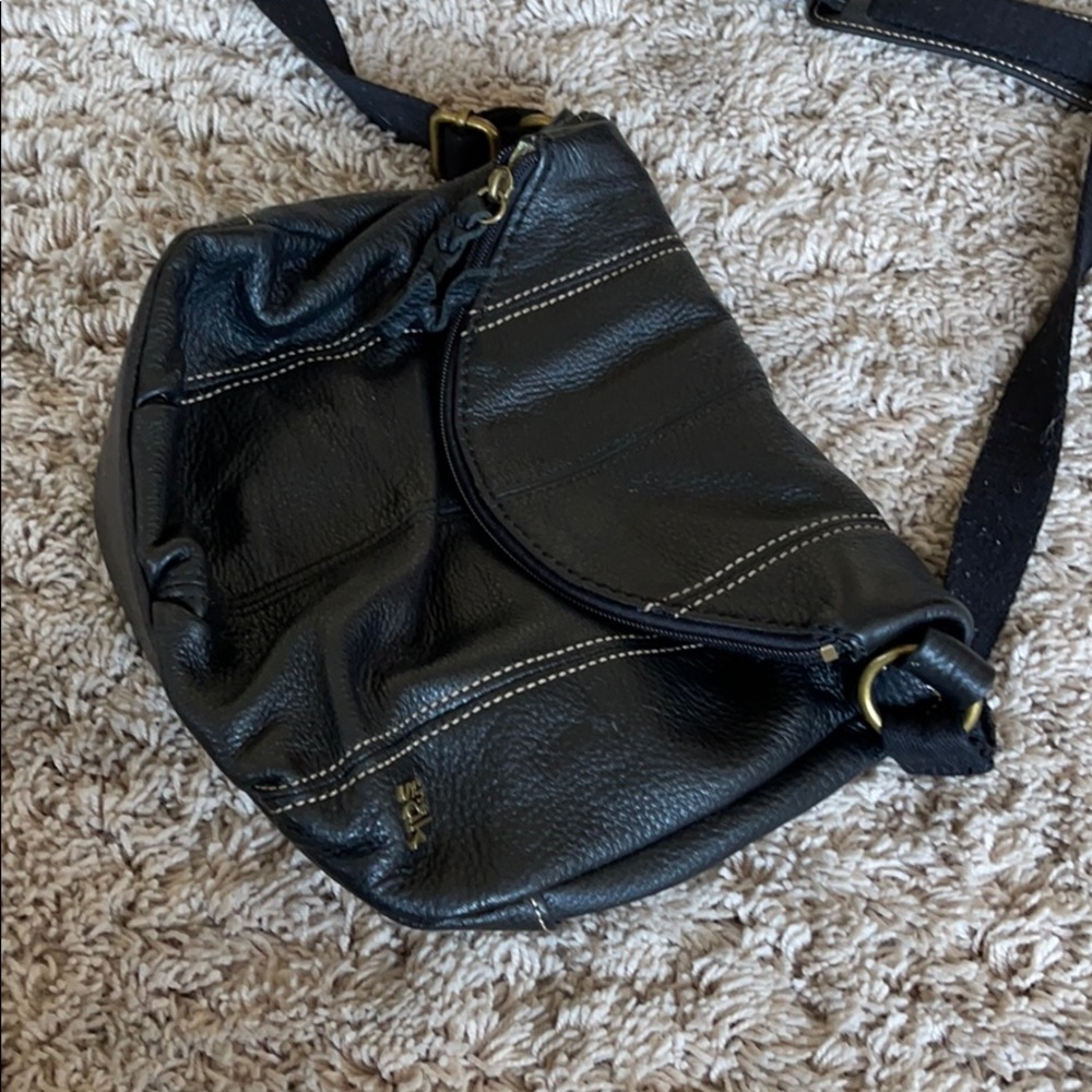 The Sak black leather purse.